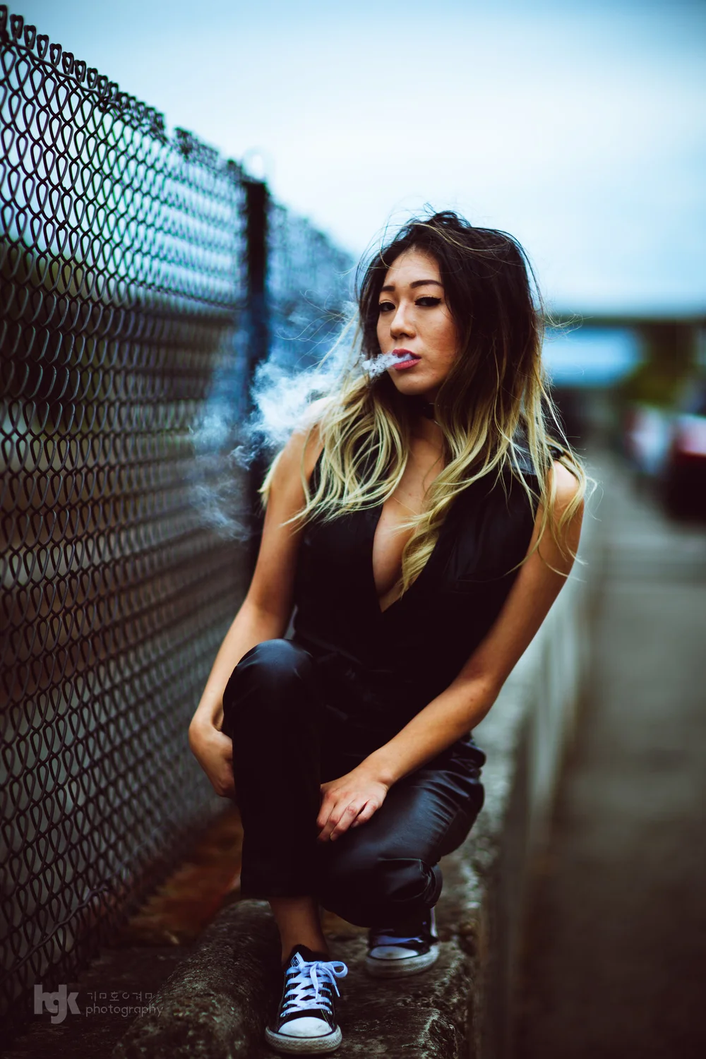 An editorial portrait study organized around a fence-side setting.