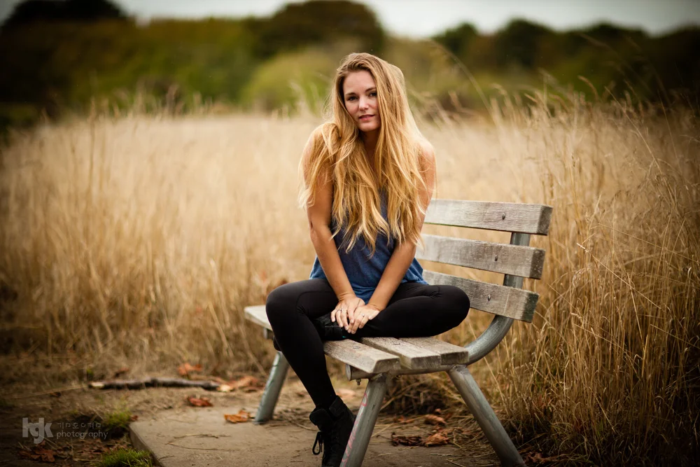 An editorial portrait study organized around a bench setting.