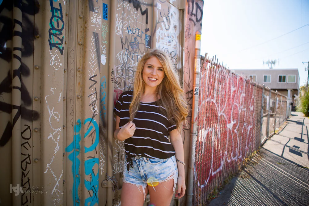 An editorial portrait study using graffiti as part of the setting.